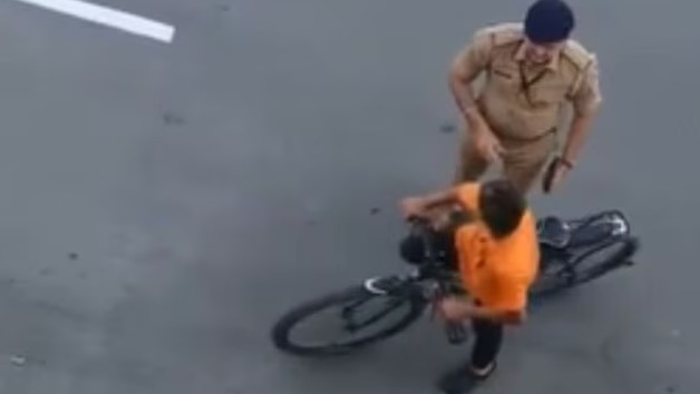 Cop caught on camera punching boy who drove cycle into PM’s convoy route in Surat, punished