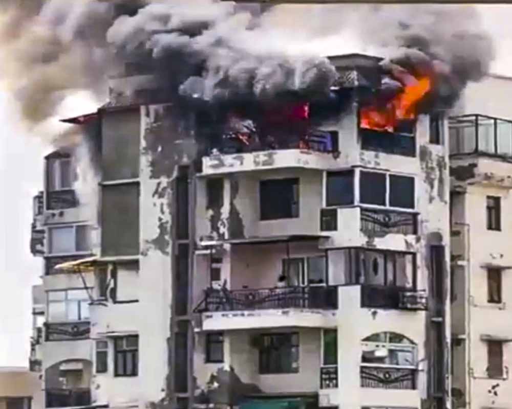 Burnt apartment balcony where family jumped to escape fire in Delhi