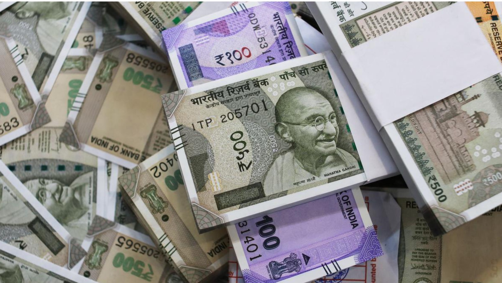 "Indian rupee gains 6 paise to close at 85.51 against US dollar in forex market"