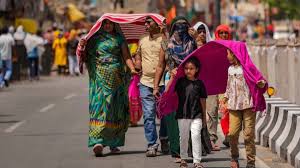 People seek shade and hydration as IMD predicts heatwave relief in India from June 14.