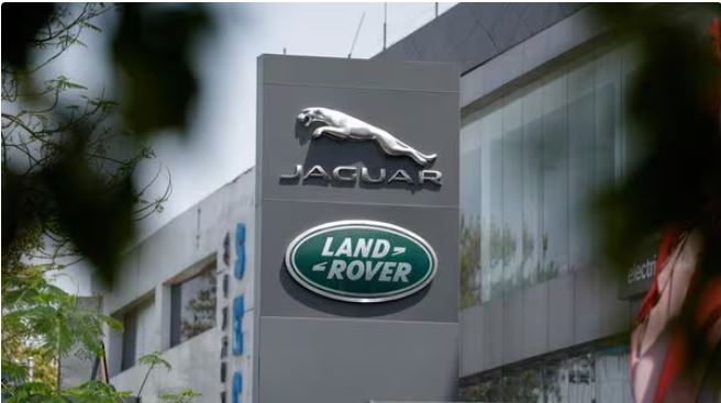 “Jaguar Land Rover headquarters with company logo, highlighting FY26 revenue guidance concerns and profitability outlook.”
