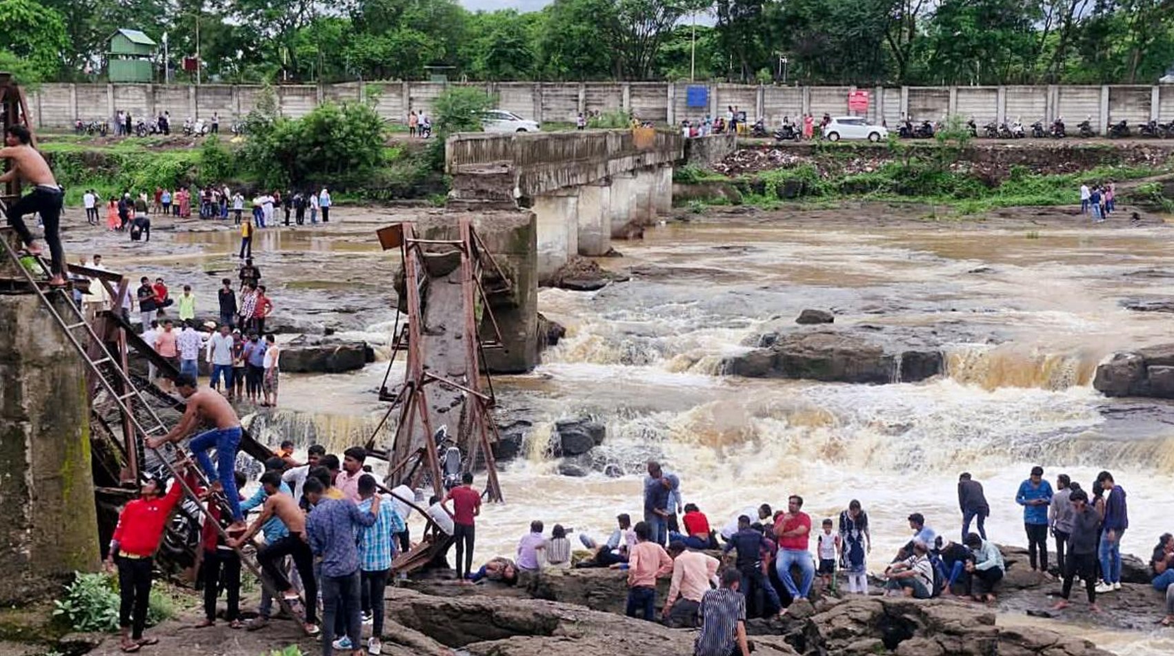 “Rescue teams at collapsed Indrayani River bridge site in Pune during ongoing search operation”