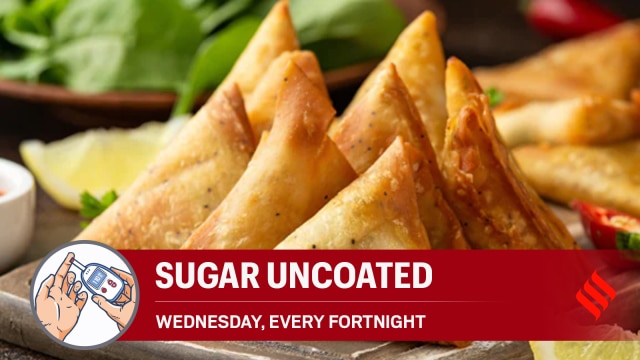 Prediabetic man checking blood sugar level after eating savory snacks