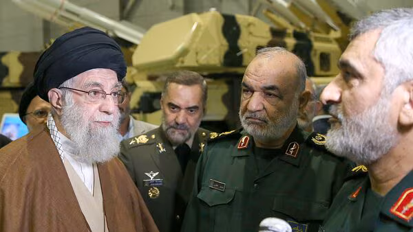 Ayatollah Ali Khamenei seated with senior IRGC commanders, symbolizing a shift in military authority during rising regional tensions.