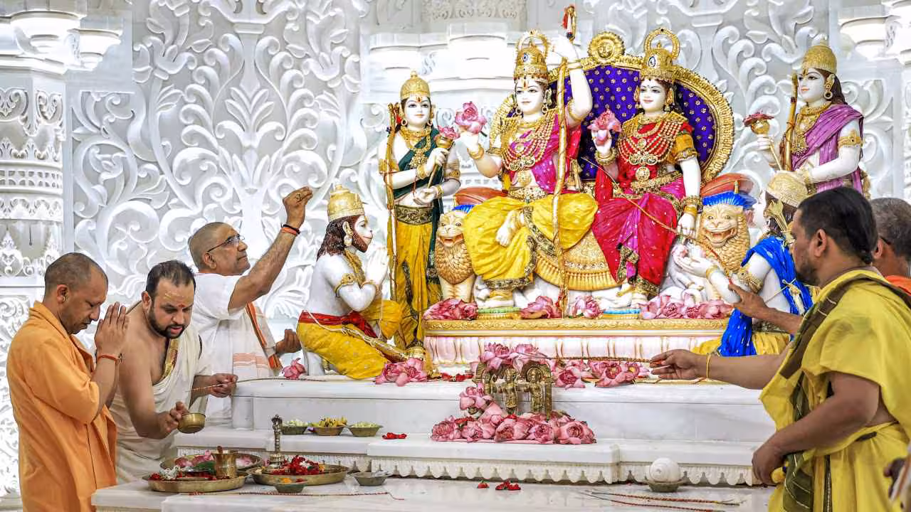 Ram Darbar idol consecration ceremony at Ayodhya, with deities Ram, Sita, Lakshman, and Hanuman beautifully adorned in regal attire.