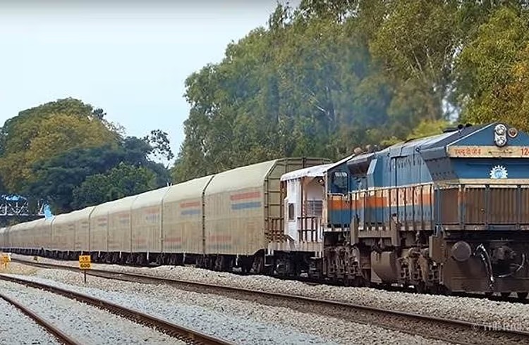 Indian Railways car carrier train transporting passenger vehicles across India