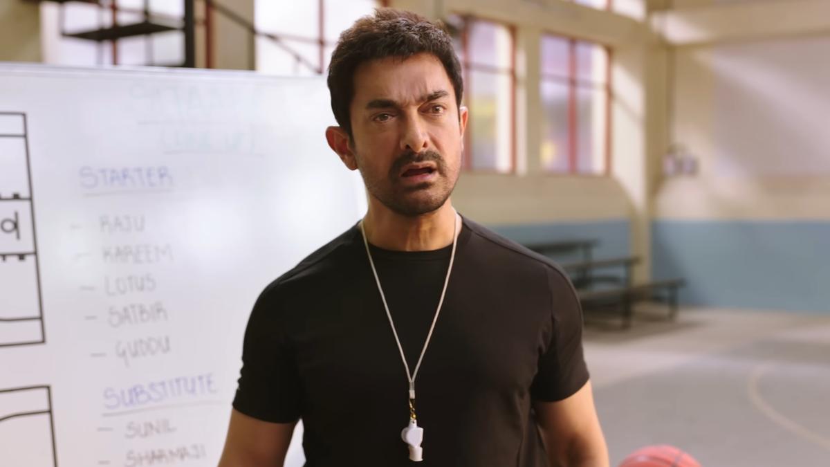"Aamir Khan in Sitaare Zameen Par encouraging children on a sports field"