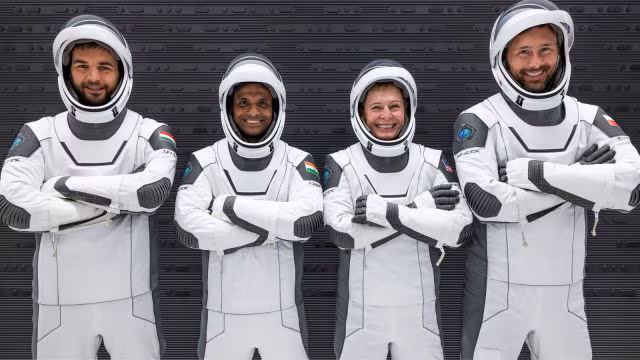 "Shubhanshu Shukla in astronaut training uniform at NASA’s Kennedy Space Center ahead of the Axiom-4 mission."