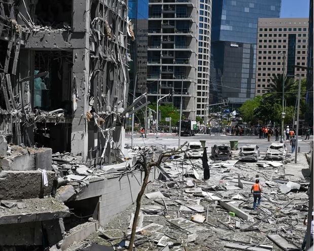 "Israeli airstrike aftermath with damaged Iranian facility amid regional conflict"