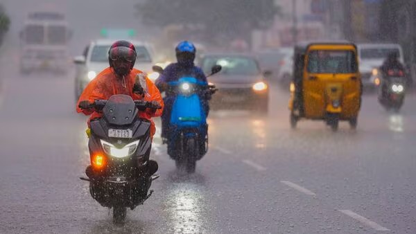Monsoon clouds over Indian city skyline with rain forecast overlay