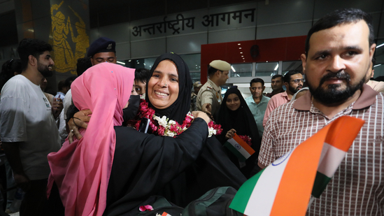 Indian nationals arriving at the airport after evacuation from war-hit Iran