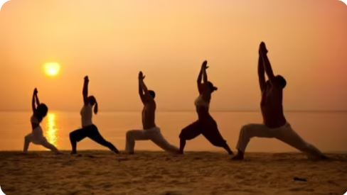 People practicing yoga outdoors during International Yoga Day 2025 on June 21