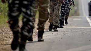 Representative image of Indian currency and CRPF insignia with terror funding headline