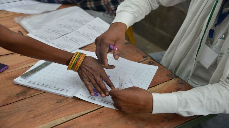 Election Commission officials counting votes during 2025 by-elections in India