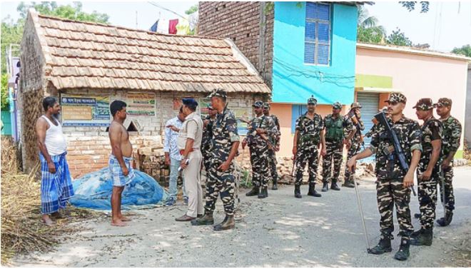 Police and forensic teams investigating the blast site near Kaliganj counting center after the explosion