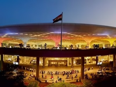 Adani Airport Holdings signage at Mumbai International Airport terminal – 2025 investment milestone