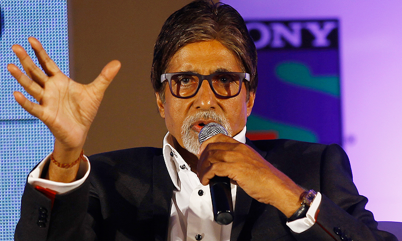 Amitabh Bachchan speaking at an event with thoughtful expression