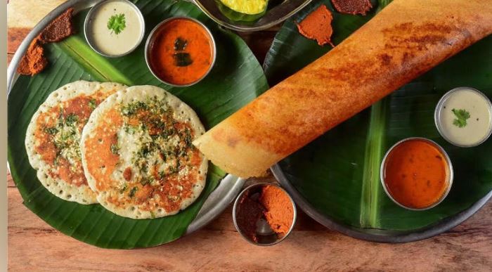 High-protein South Indian breakfast plate featuring idli, dosa, and chutney