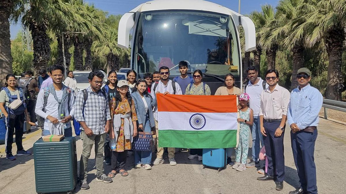 Evacuated Indian nationals boarding transport buses from Israel via Jordan and Egypt