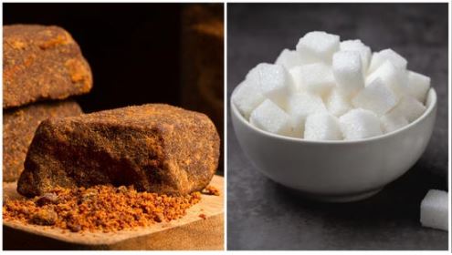 A bowl of jaggery chunks beside refined white sugar, representing the healthy vs unhealthy sweetener debate