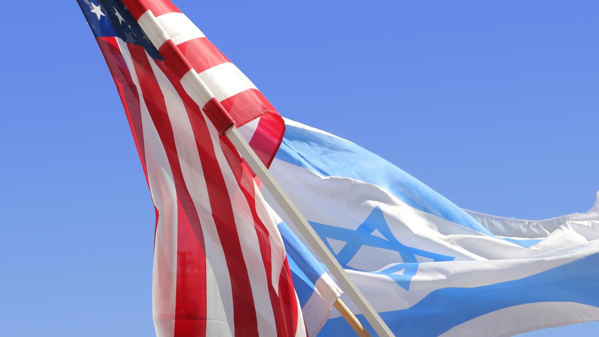 Police personnel detaining individuals in Jammu and Kashmir over flag display controversy