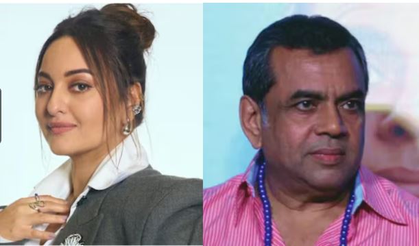 Sonakshi Sinha speaking at a media event with a poster of Hera Pheri in the background