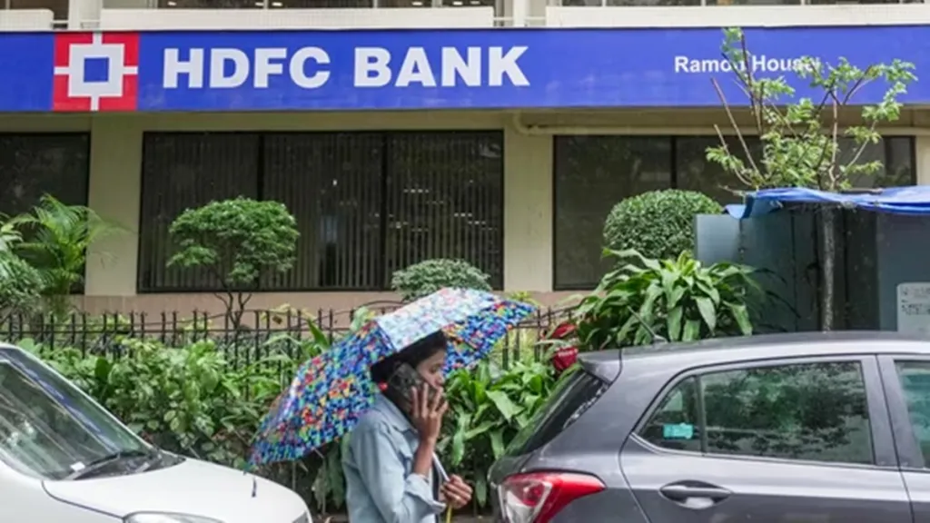 HDFC Bank and HDB Financial logos side by side with stock market background”