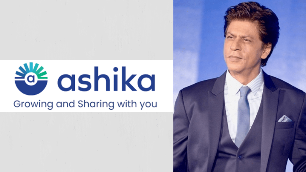 Shah Rukh Khan alongside Ashika Ventures branding in a business setting