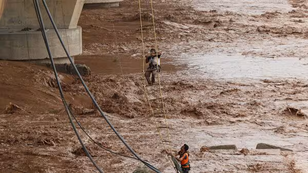 Man clinging to rope midstream in Jammu’s Tawi River during rescue operation