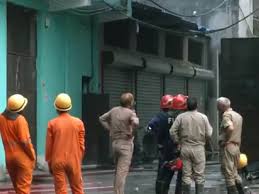 Firefighters at factory near Rithala metro station after deadly fire incident in Delhi
