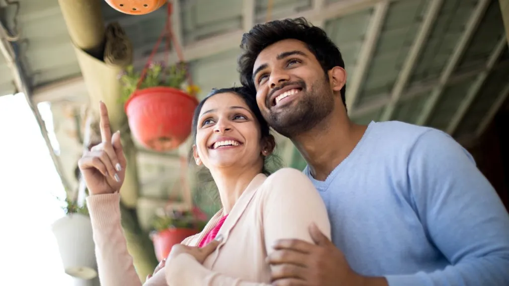 Senior couple planning retirement with financial advisor for ₹1 lakh monthly income