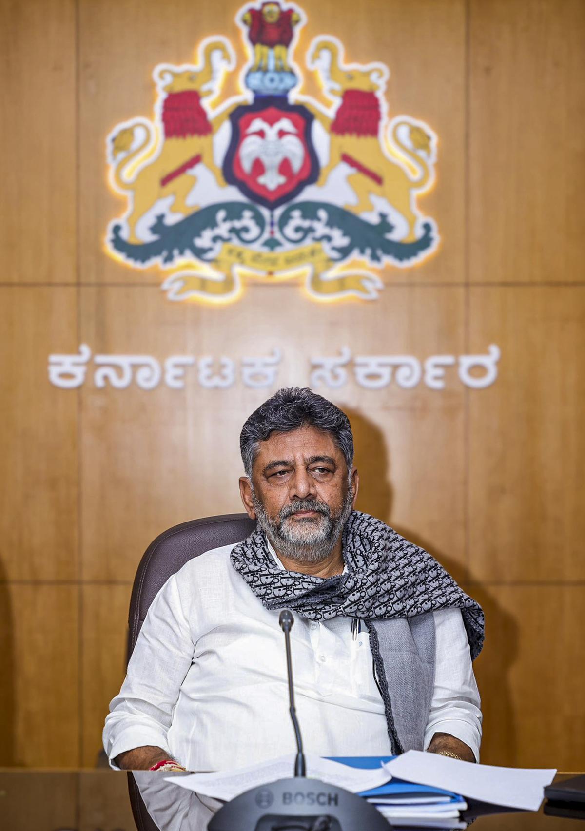 D.K. Shivakumar addressing the importance of building plan approval and possession certificate for constructions