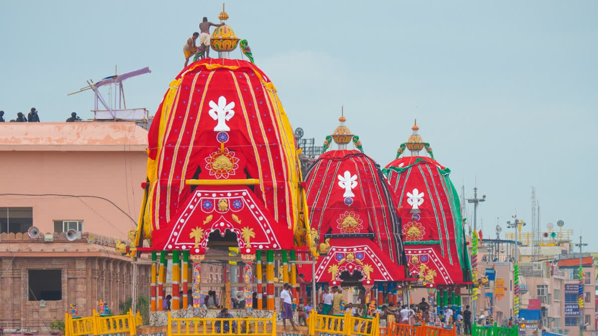 Devotees pulling the grand chariot of Lord Jagannath during the 2025 Rath Yatra in Puri.