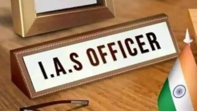 IAS officer moving files in a cluttered government office, symbolizing bureaucratic work culture.