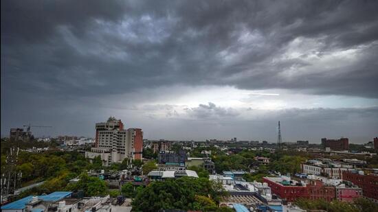 Dark clouds gather over Delhi skyline ahead of thunderstorms and rain, as predicted by the IMD