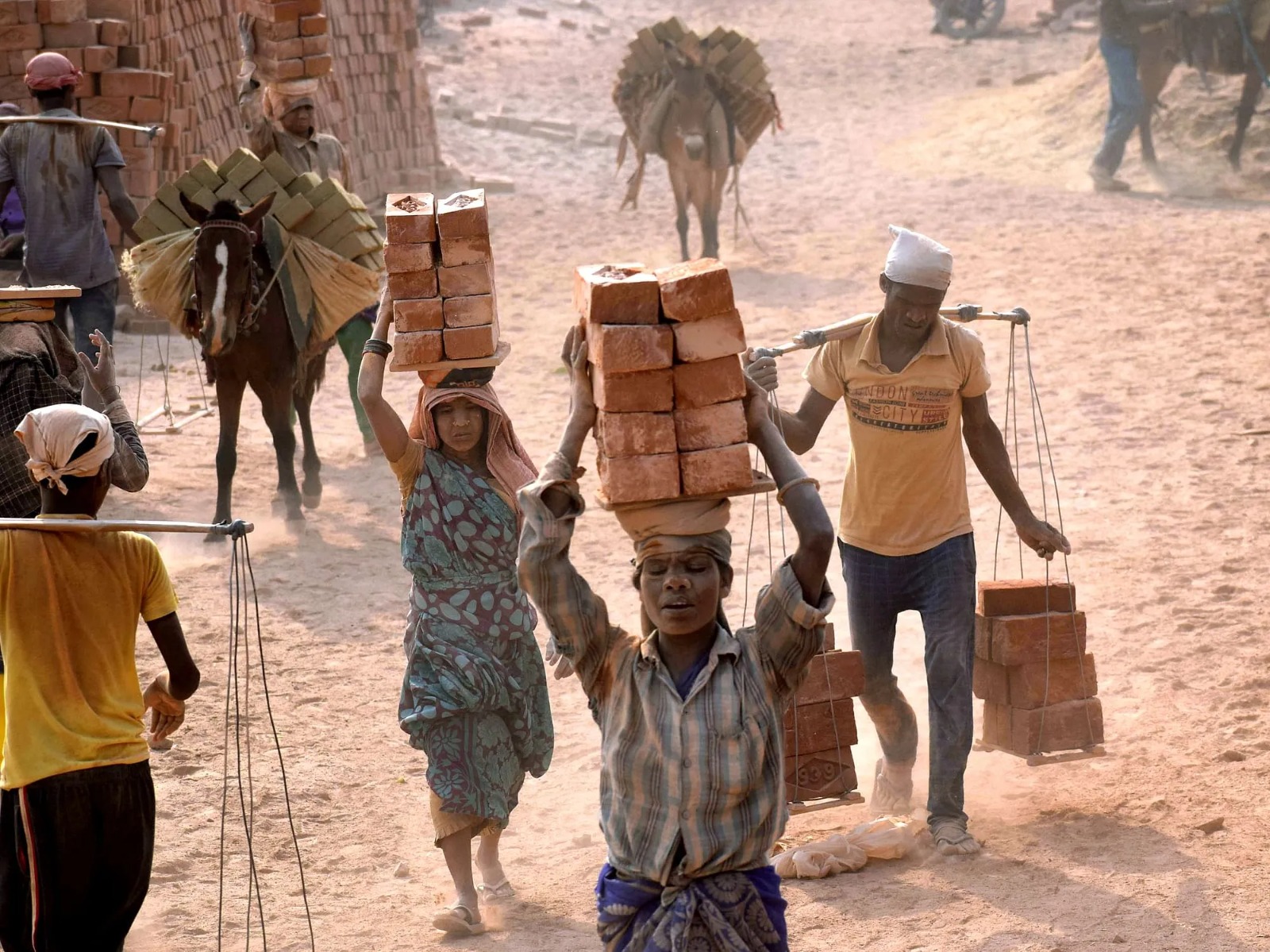 Rescued migrant labourer from Uttarakhand receiving help from officials and activists in Punjab after escaping bonded labour at a brick kiln