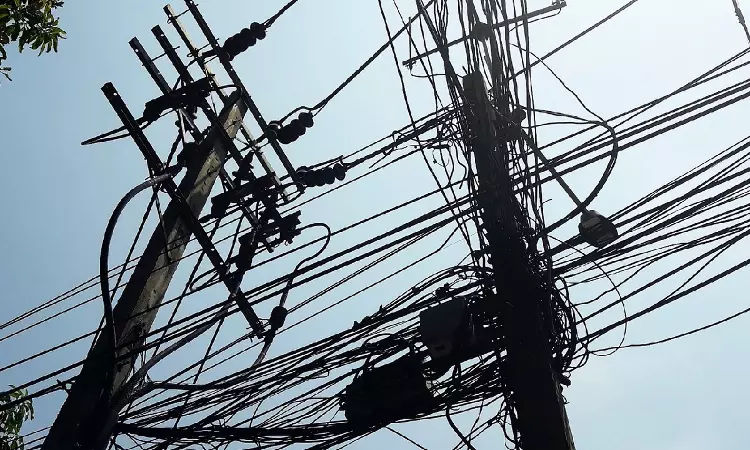 Jharkhand resident standing outside his home after 60 days without electricity, with High Court finally ordering power restoration