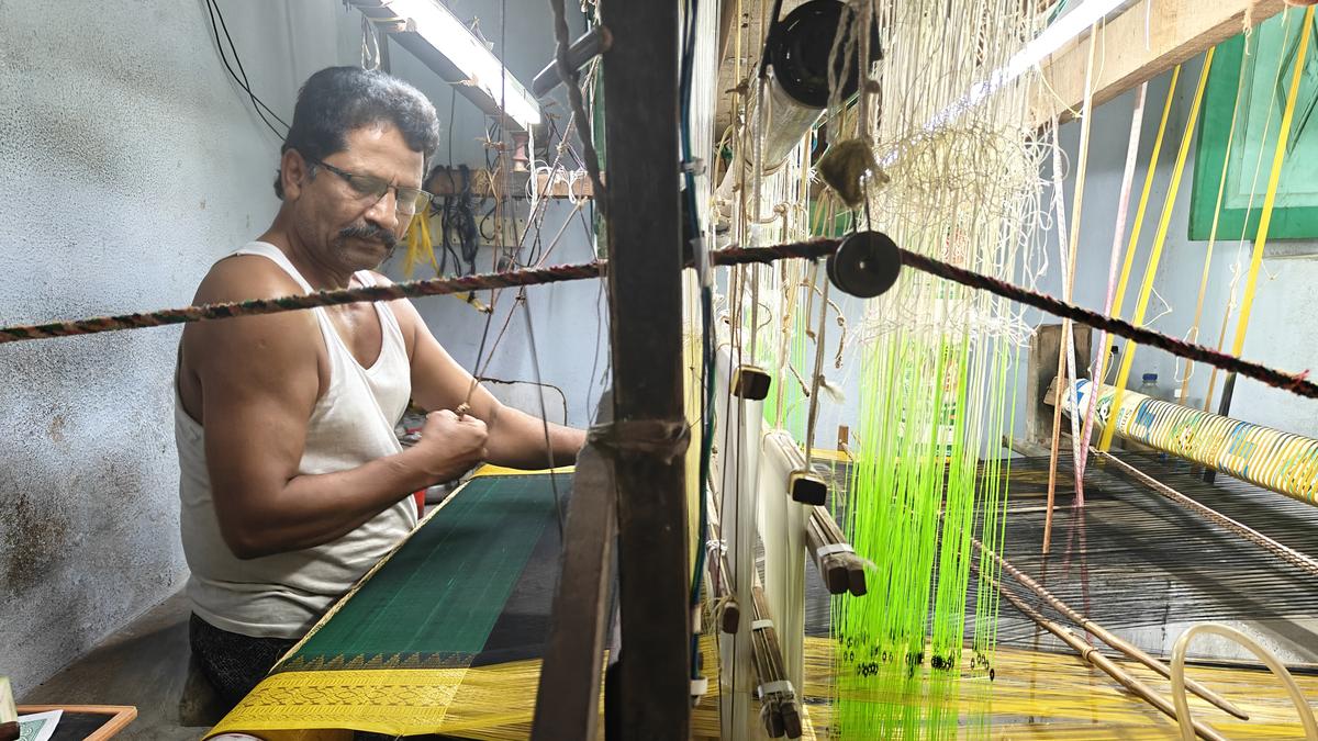 “Artisan weaving a Kuppadam saree showcasing intricate traditional patterns and vibrant colors”