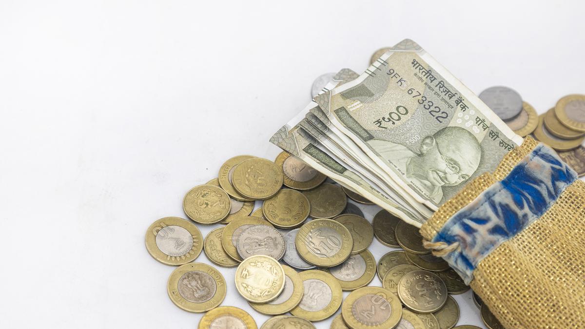 “Indian Rupee currency notes with U.S. dollar bills showing currency exchange”