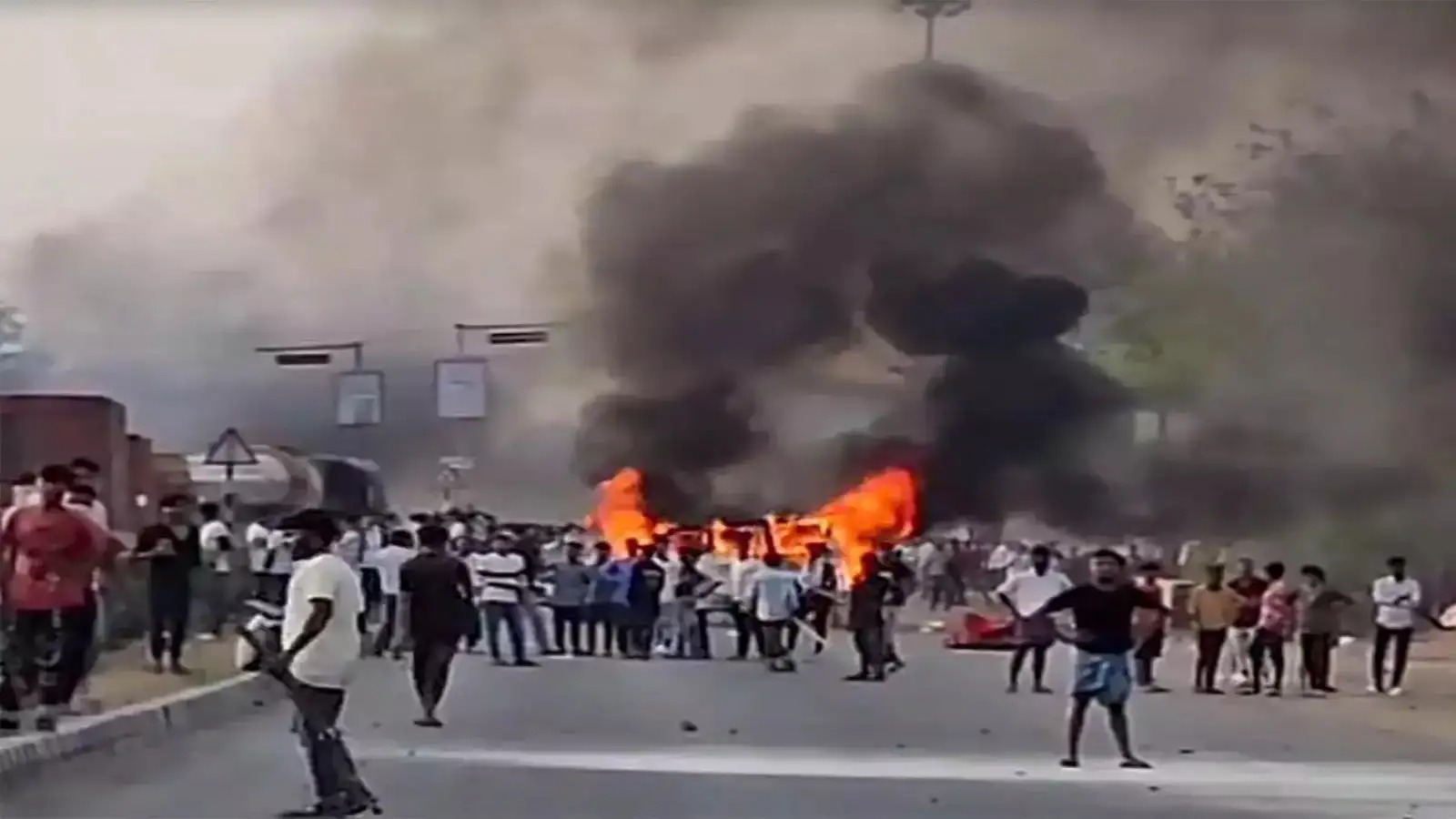Detained migrant workers from West Bengal wait at a police station in Odisha.
