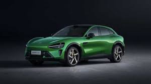 Xiaomi YU7 electric vehicle showcased at launch event, EV fans surrounding it