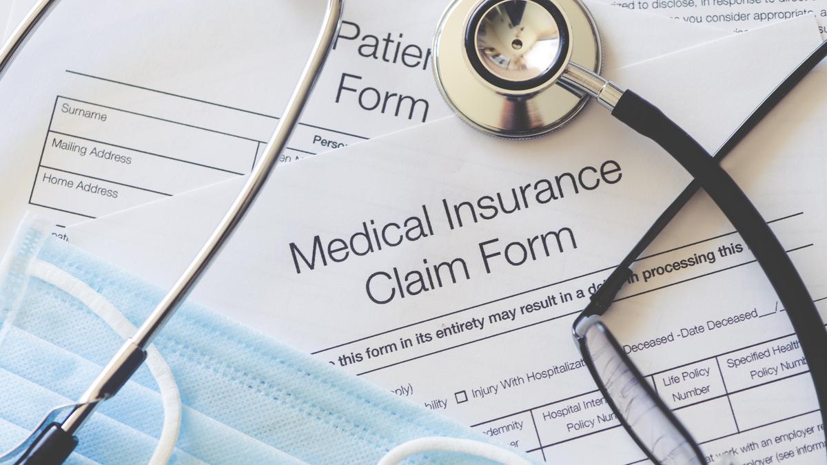 Person filling insurance form highlighting pre-existing diseases disclosure