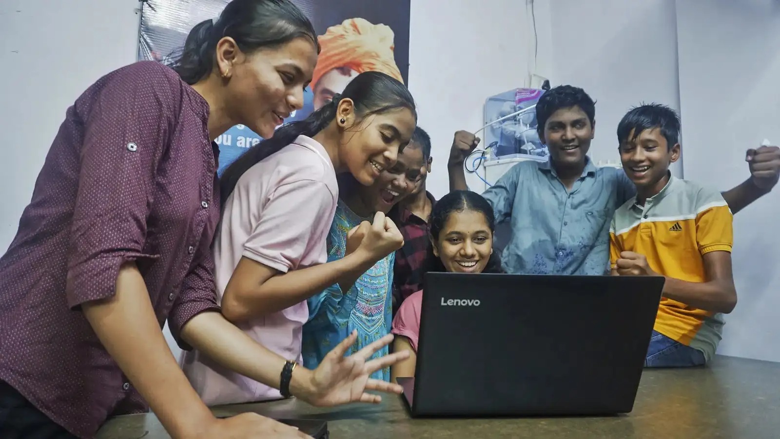 Students checking their names in FYJC merit list on school notice board