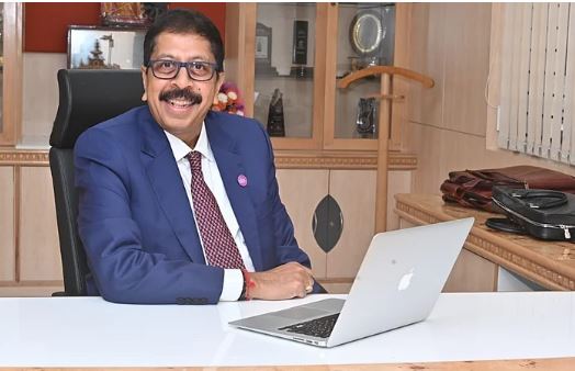 Karnataka Bank headquarters building with falling stock graph overlay representing CEO resignation impact