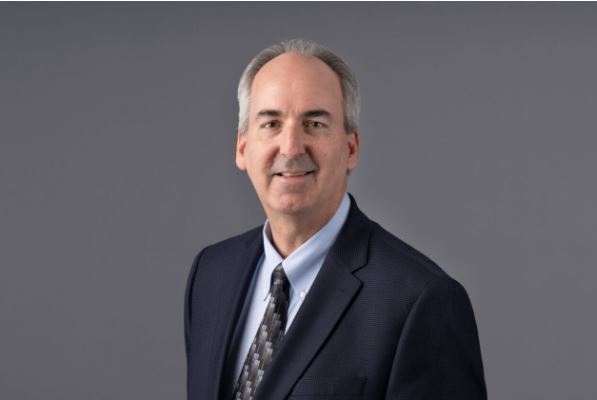 Cryptocurrency researcher discussing the future of digital finance with Vizzve Finacr interface in background