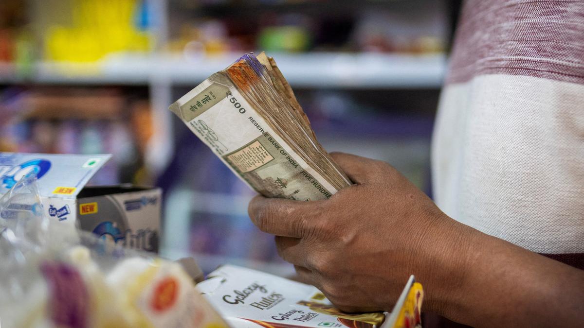Indian Rupee currency notes with U.S. dollar bills representing forex market movement