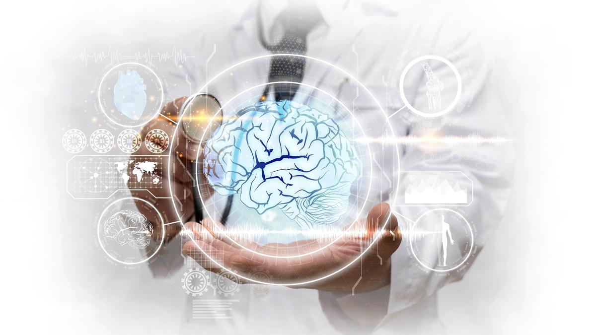 Medical professional demonstrating MRgFUS non-surgical technology for tremor treatment in India