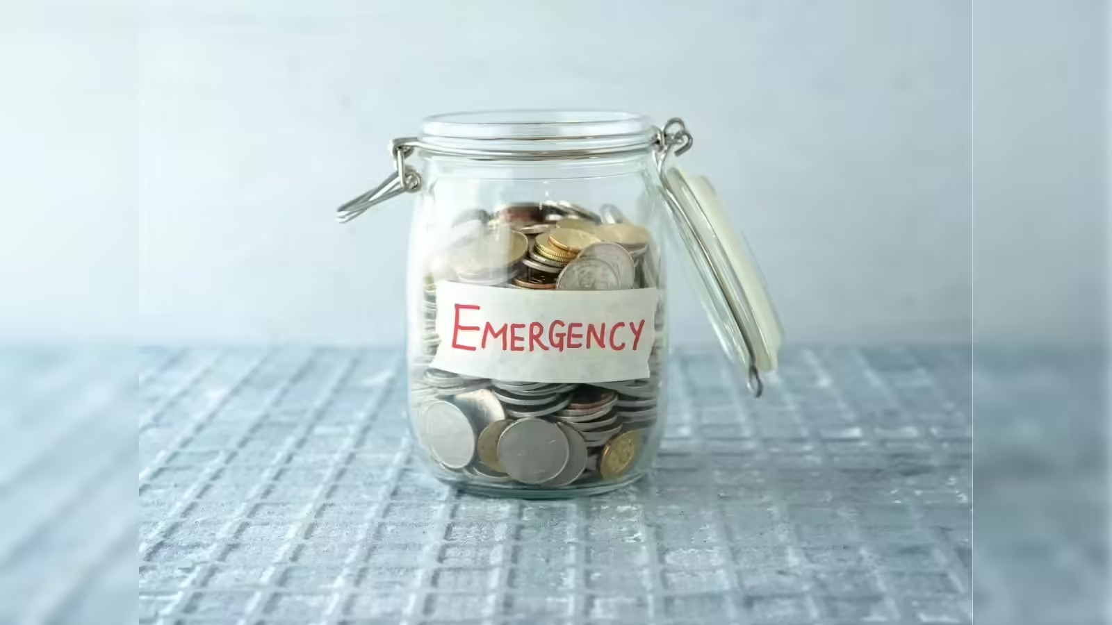 Indian family reviewing finances and emergency savings with help from the Vizzve Finance app.