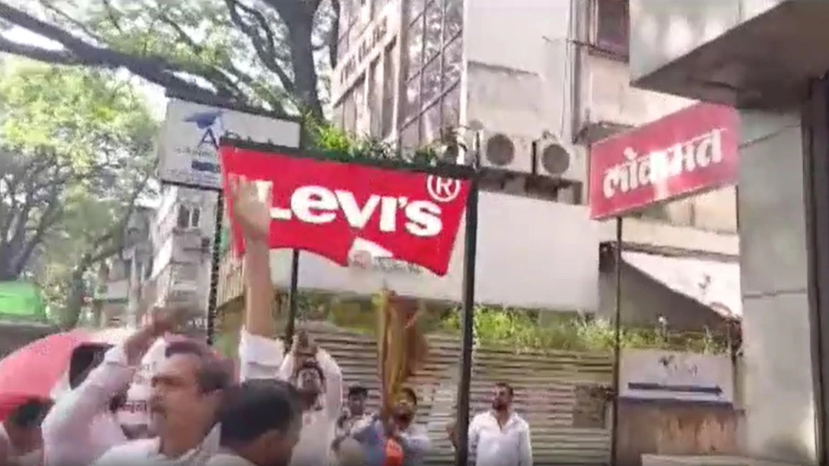 MNS workers protesting over Marathi language outside a local shop