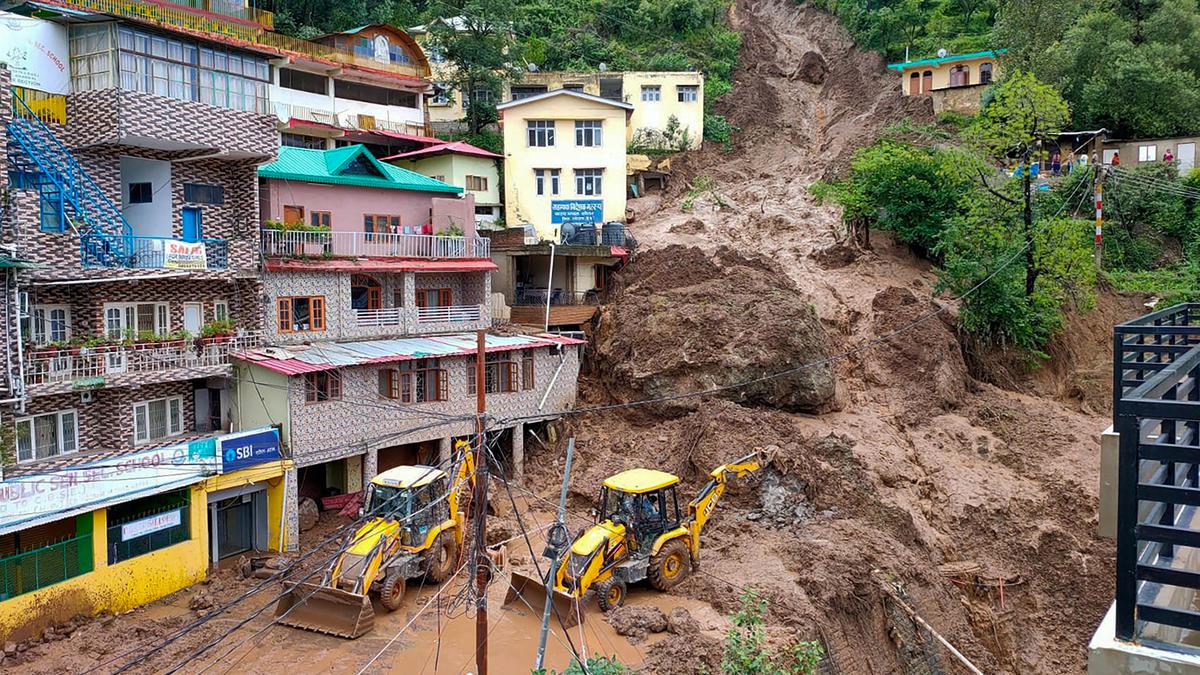 Flooded streets and landslide damage in Himachal Pradesh during heavy monsoon rains